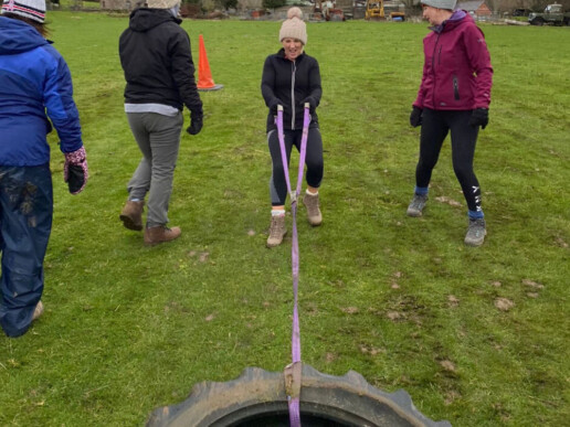 Kate pulling a tractor tire